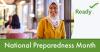 A woman with her hair wrapped smiles. National Preparedness Month. 