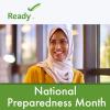 A woman with her hair wrapped looks off into the distance smiling. National Preparedness Month. 