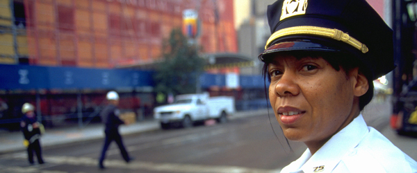 An NYPD police officer guards the area around the World Trade Center.