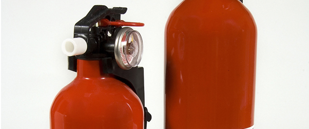 Close up of two fire extinguishers. 
