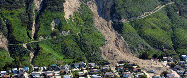 Aerial view of a land slide down a mountain with earth covering 