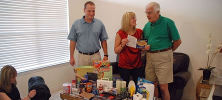 A family gathering supplies for an emergency kit