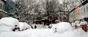 A neighborhood street covered 3 foot deep in snow A neighborhood street covered 3 foot deep in snow