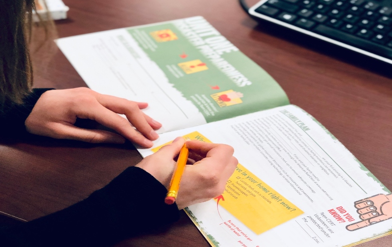 Girl reviewing brochure