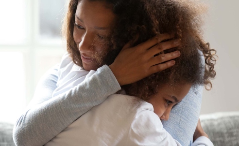 Mother comforting her daughter