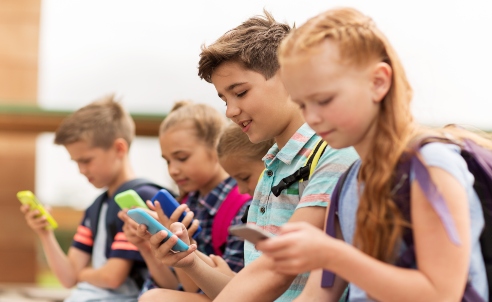 Kids texting on their cell phones