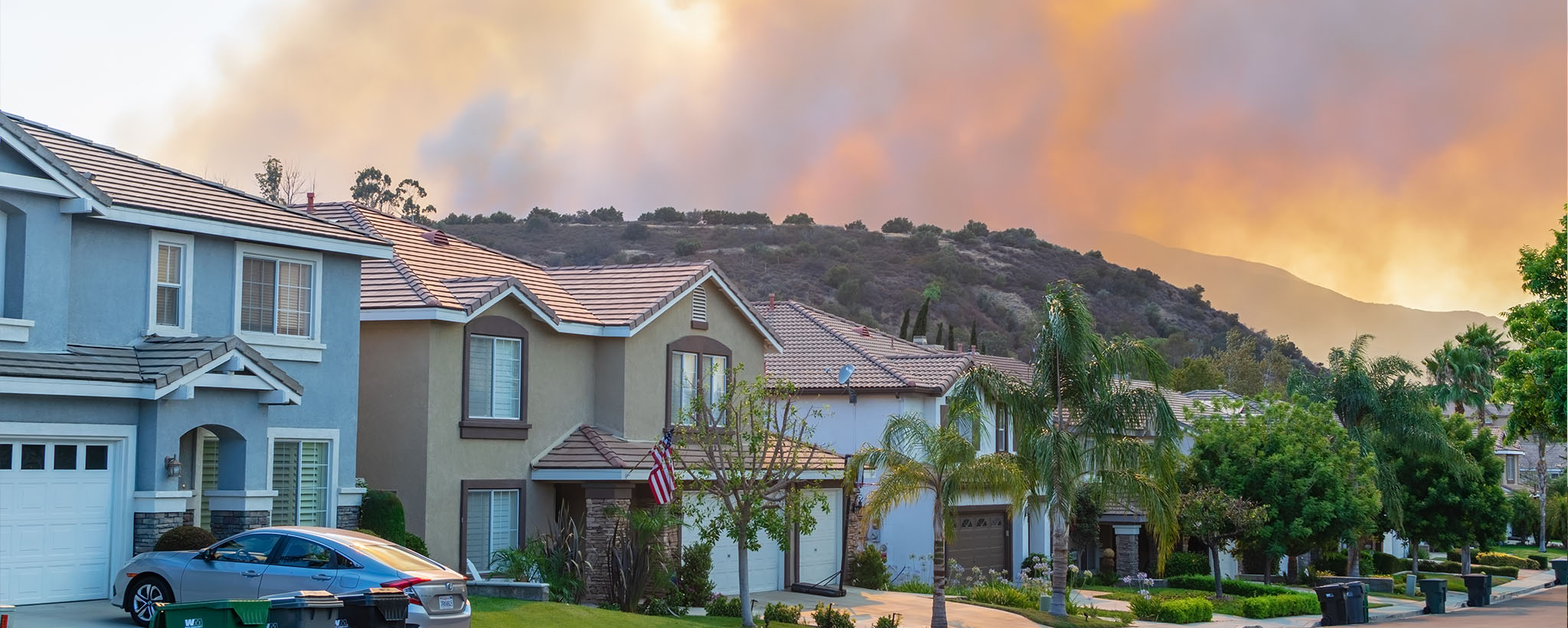 Houses with fire in the background 