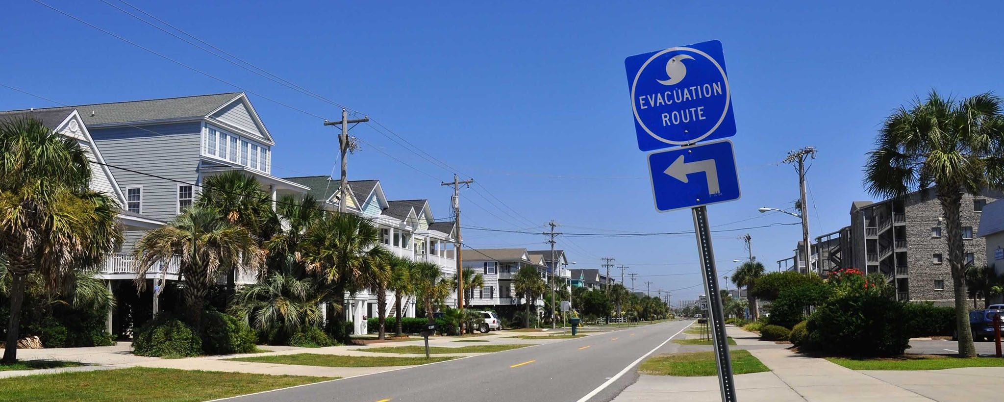 A hurricane evacuation route sign on a neighborhood street 