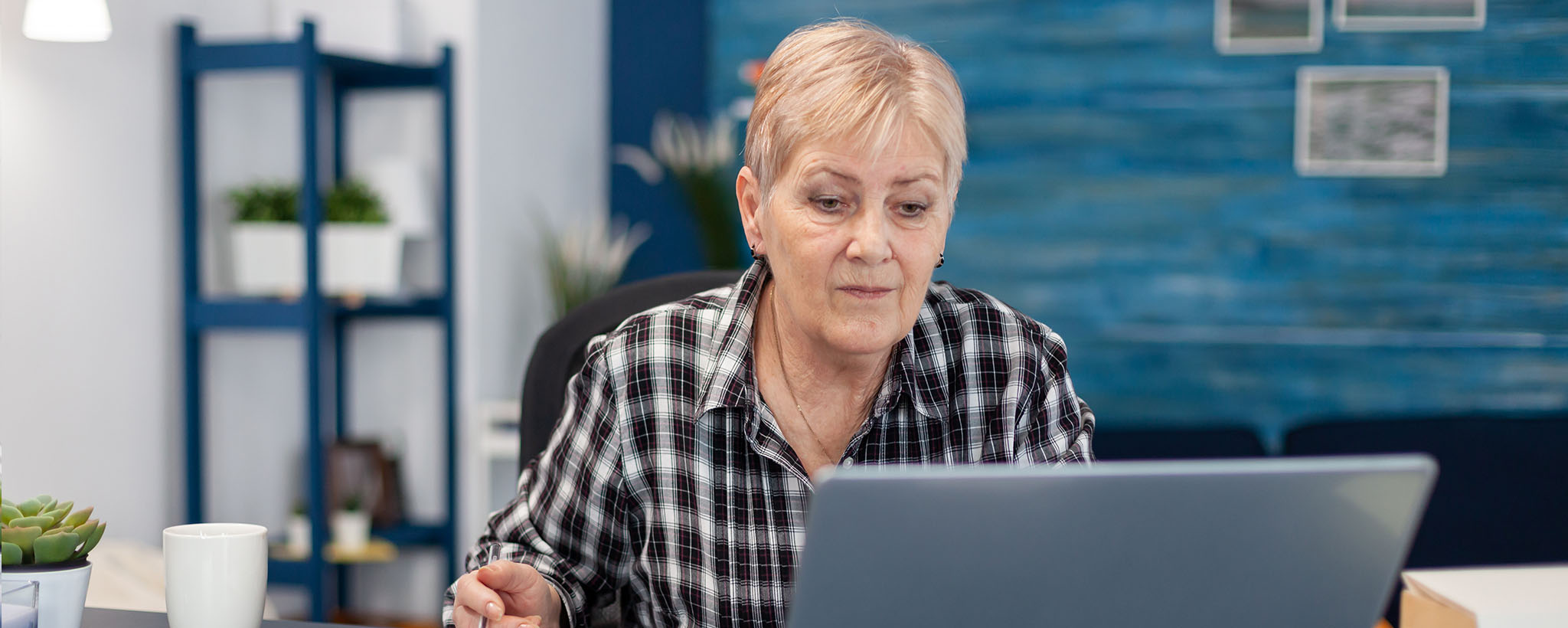 An older woman on her laptop. 