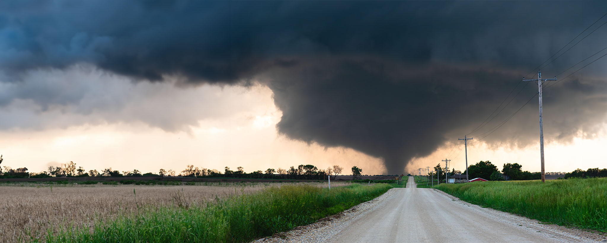 A tornado approaching a road. 