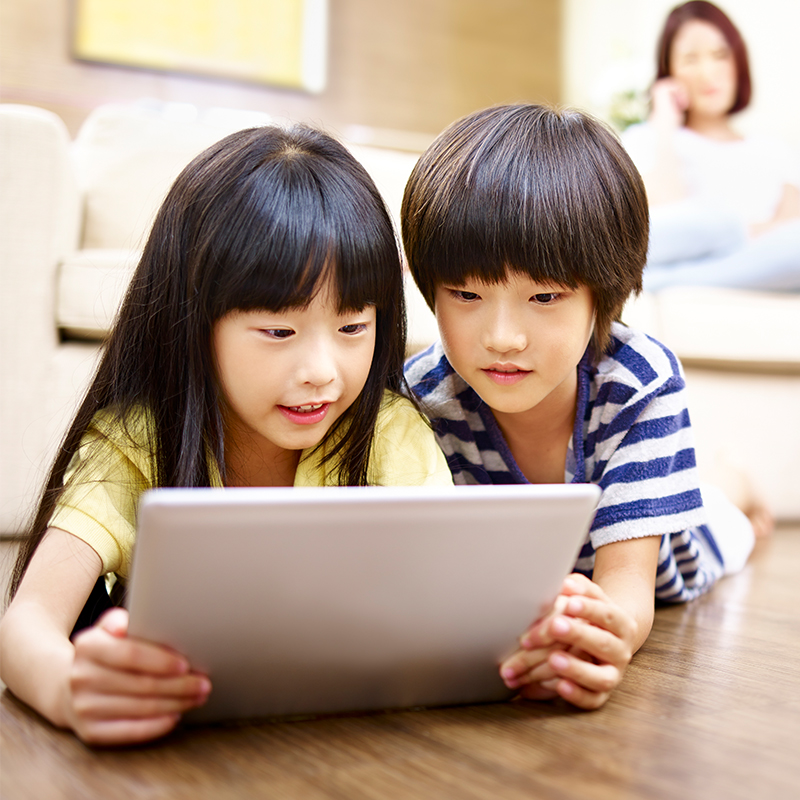two kids on a tablet