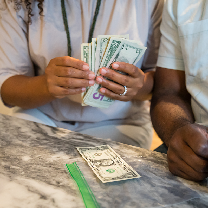 A woman counting out money