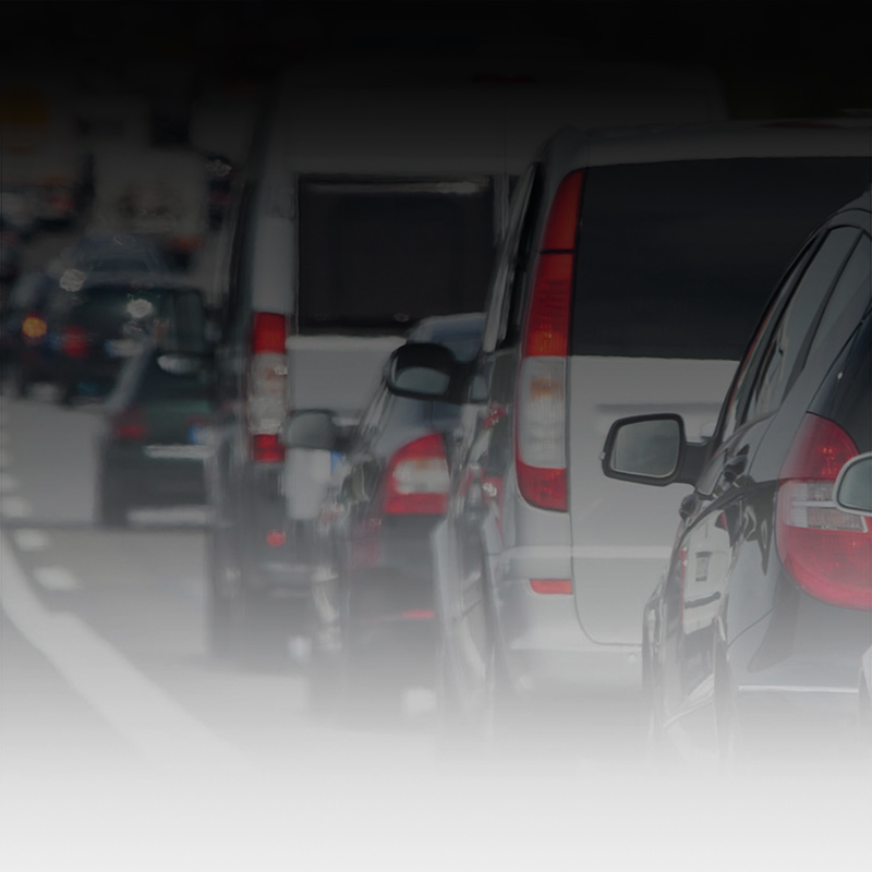 Cars in traffic on a highway.