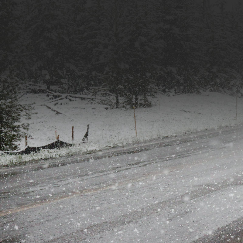 Picture of a snow covered road during a snow storm