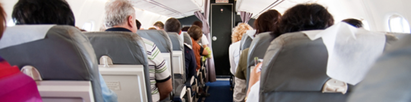 January 29th, 2000. People on board an airplane preparing for take-off.