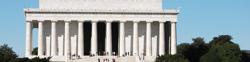 February 4th, 2011. Tourists stand, sit, and walk around the reflecting pool and the Lincoln Memorial.
