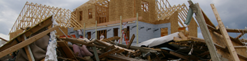 May 25th, 2008. The skeleton structure of a house stands above the rubble and debris of the home it will soon be replacing.