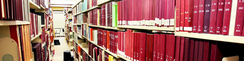 January 6th, 1998. An empty library aisle displays a plethora of red-spine encyclopedias.