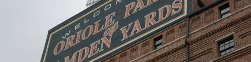 September 15th, 2003. Looking up at the brown brick buildings on which the Camden Yards sign stands.