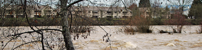 December 18th, 1964. High waters from the river gush through the streets. December 18th, 1964. High waters from the river gush through the streets.