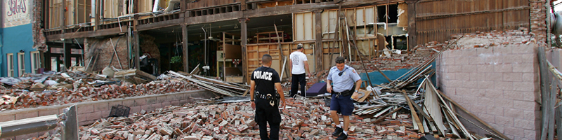 September 24th, 2005. First responders survey the damage to a brick building September 24th, 2005. First responders survey the damage to a brick building