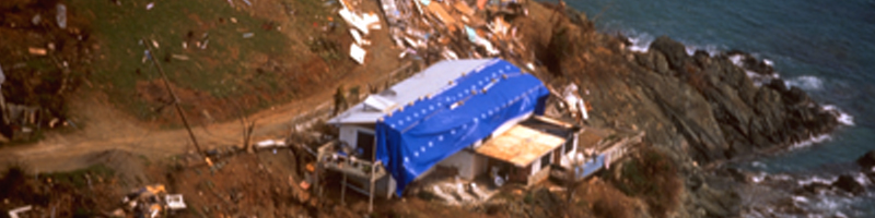 September 15th, 1995. Debris from a destroyed home covers the coastline. September 15th, 1995. Debris from a destroyed home covers the coastline.