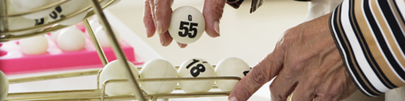 September 17th, 2003. An elderly woman picks up a bingo ball. September 17th, 2003. An elderly woman picks up a bingo ball.