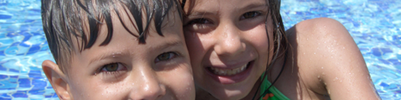 June 4th, 2008. Two children pose for a photo next to the pool. June 4th, 2008. Two children pose for a photo next to the pool.