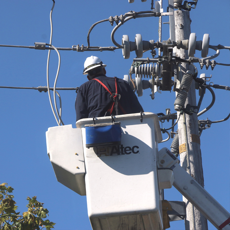 a technician working on power lines