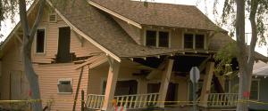 A house cracked and broken from earthquake damage A house cracked and broken from earthquake damage