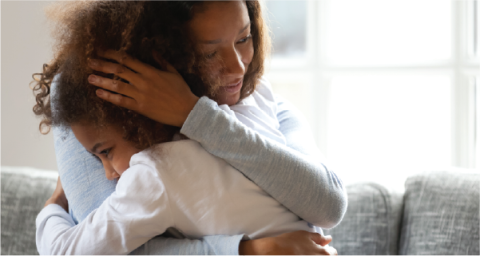 mother hugging daughter