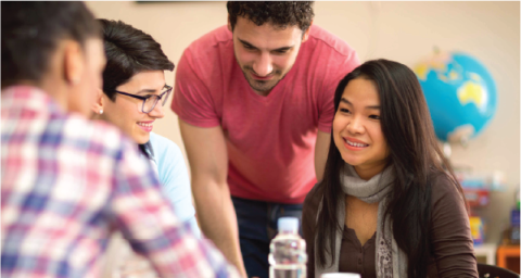 Teenagers talking in classroom