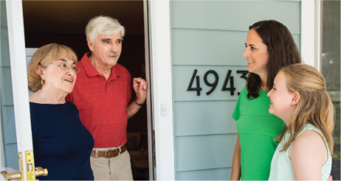 neighbors talking at the front door