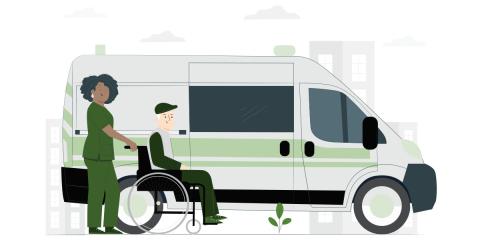Older man in wheelchair being helped into a bus by a healthcare worker