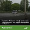 An SUV droves through a flooded road. Six inches of water is enough to cause you to lose control of your vehicle. Turn around, don't drown. #BeInformed