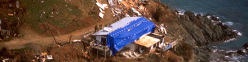 September 15th, 1995. Debris from a destroyed home covers the coastline. September 15th, 1995. Debris from a destroyed home covers the coastline.